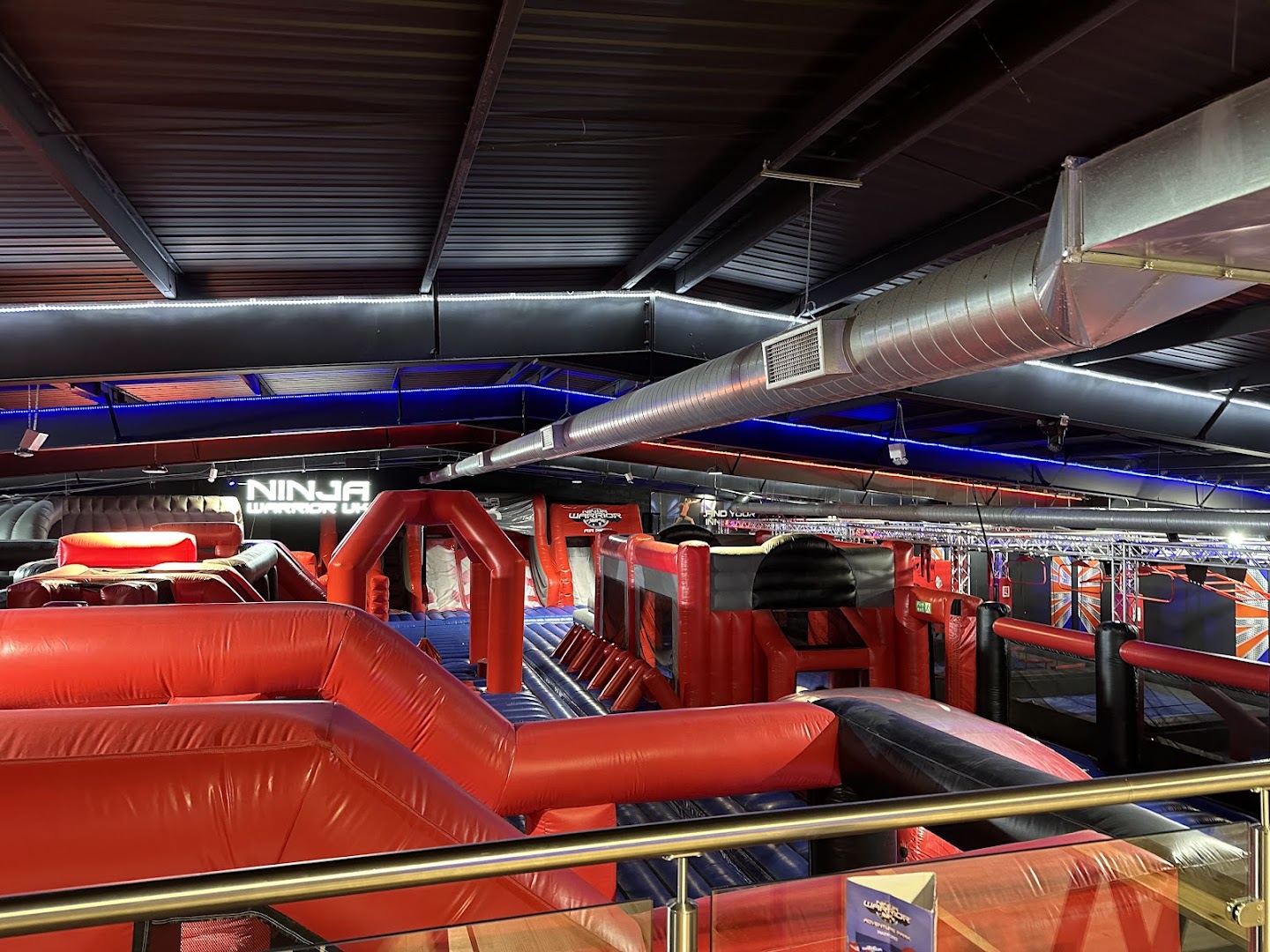 Ninja Warrior UK Watford featuring vibrant inflatable obstacle courses for kids