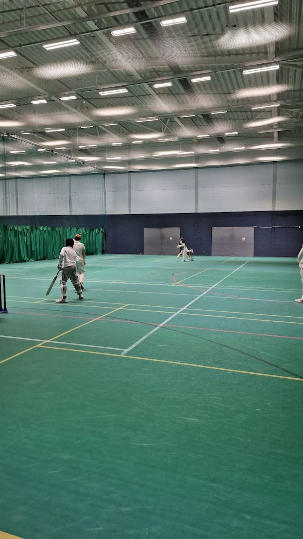 Children playing cricket indoors at Peter May Sports Centre