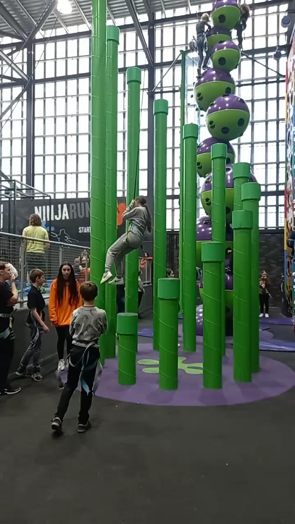 Kids climbing colorful poles at Waltham Forest Feel Good Centre's adventure zone