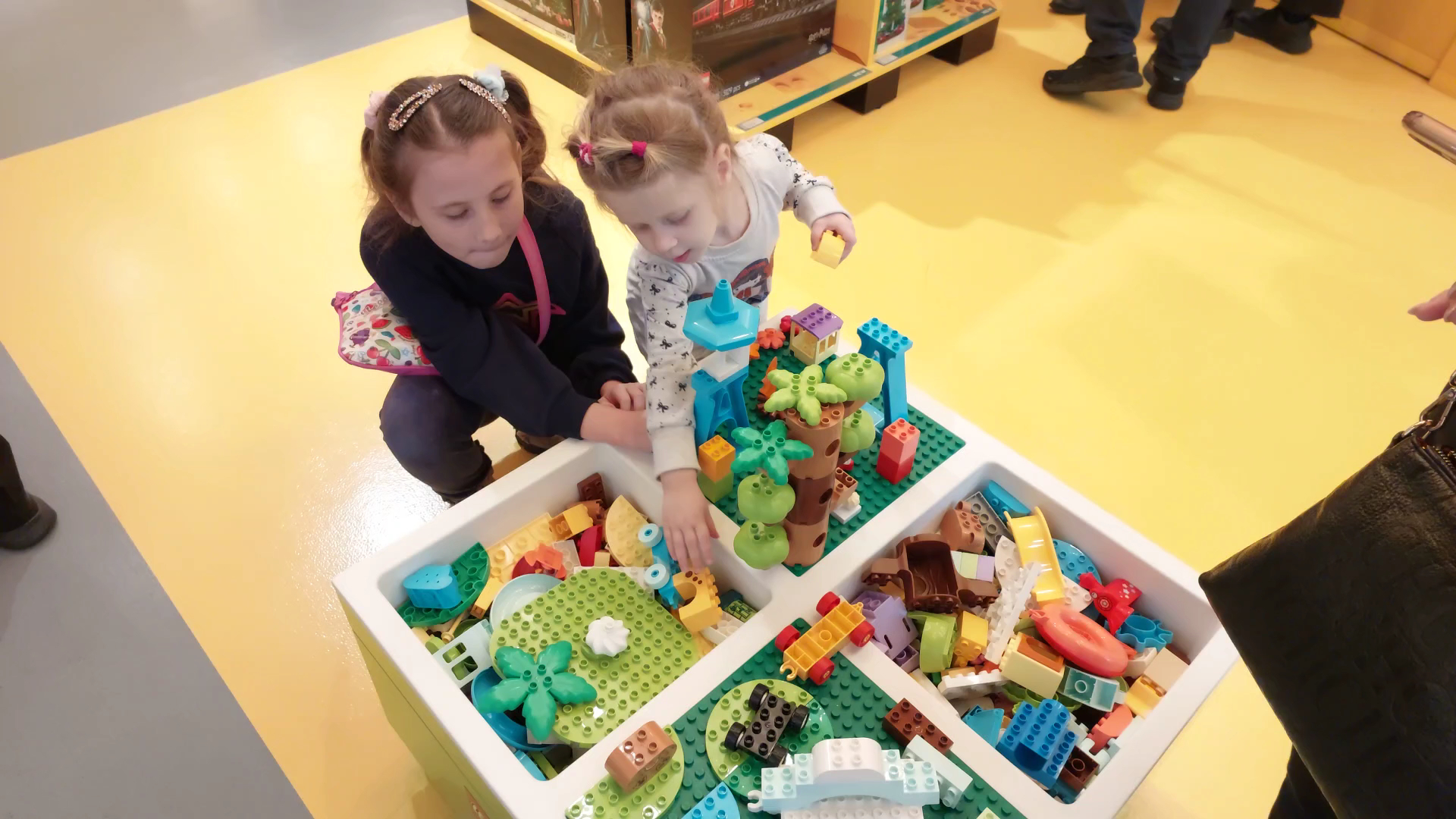 Children building with LEGO bricks at LEGO® Store London - Westfield