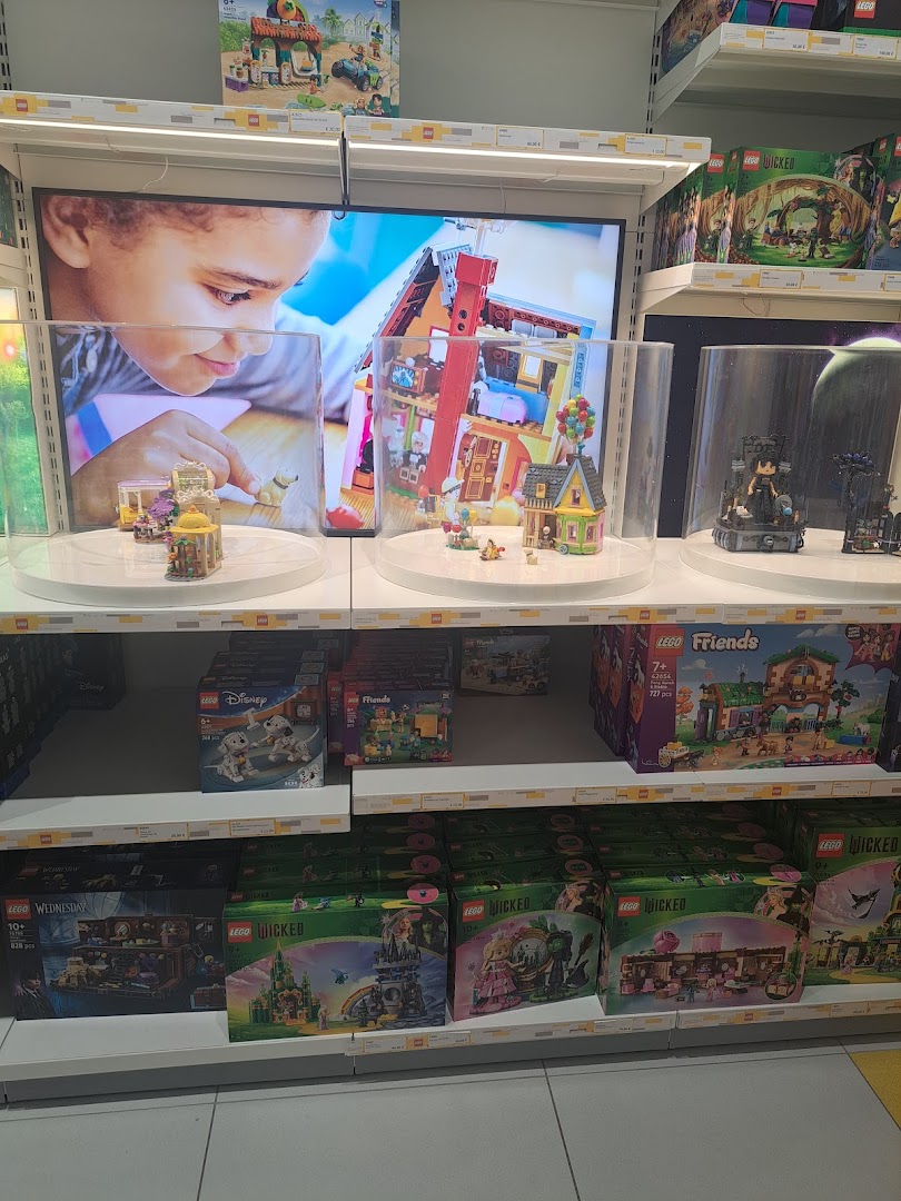 Child interacting with LEGO sets at LEGO® Store London - Westfield